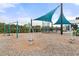 A playground with climbing structures and swings over mulch at 6808 Cranes Roost Rd, Harmony, FL 34773