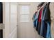 Bright walk-in closet with a window for natural light and ample storage space at 6808 Cranes Roost Rd, Harmony, FL 34773