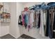 Ample storage space in this walk-in closet with organized shelving and hanging racks at 6808 Cranes Roost Rd, Harmony, FL 34773