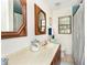 Bathroom featuring tiled walls, framed mirror, vanity, and a bathtub with shower at 725 Montana Ave, St Cloud, FL 34769