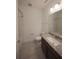 Clean bathroom featuring a shower-tub combo, toilet, and granite-topped vanity at 7381 Alpine Butterfly Ln, Orlando, FL 32819