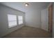 Well-lit bedroom with carpet, a double window and a closet at 7381 Alpine Butterfly Ln, Orlando, FL 32819