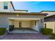 Spacious two-car garage with an open door and brick driveway at 7381 Alpine Butterfly Ln, Orlando, FL 32819