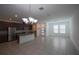 Open-concept kitchen with granite countertops, stainless steel appliances, and a large island at 7381 Alpine Butterfly Ln, Orlando, FL 32819