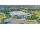 Aerial view of the exterior of the community center with colorful accents and ample parking at 7973 Greengard St, Orlando, FL 32827