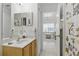 Bathroom leading into the living room, shower with tropical-themed shower curtain at 8595 Sunrise Key Dr, Kissimmee, FL 34747