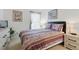 Bedroom with a comfortable queen-size bed, soft bedding, natural light, and serene ambiance at 8595 Sunrise Key Dr, Kissimmee, FL 34747
