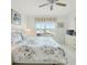 Bright bedroom featuring a ceiling fan, neutral decor, and a large window with backyard views at 8595 Sunrise Key Dr, Kissimmee, FL 34747