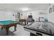 Game room featuring a pool table, air hockey, and foosball table, providing ample entertainment options at 8595 Sunrise Key Dr, Kissimmee, FL 34747