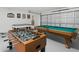 Game room with a pool table and a foosball table at 8595 Sunrise Key Dr, Kissimmee, FL 34747