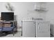 Laundry area featuring a modern washer and dryer set for convenient and efficient chore completion at 8595 Sunrise Key Dr, Kissimmee, FL 34747