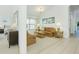 Comfortable living area with neutral tones, carpeting, a plush sofa set, and natural light at 8595 Sunrise Key Dr, Kissimmee, FL 34747