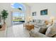 Bright living room with a sofa set and view of the pool at 8595 Sunrise Key Dr, Kissimmee, FL 34747