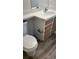 Clean bathroom featuring vanity with sink, toilet, and vinyl flooring at 8927 Legacy Ct # 302, Kissimmee, FL 34747