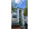 Inviting exterior of a condominium with private balcony and verdant landscaping at 8927 Legacy Ct # 302, Kissimmee, FL 34747