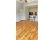 Bright living room featuring wood floors and eat-in kitchen with breakfast bar at 8927 Legacy Ct # 302, Kissimmee, FL 34747