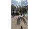 Community pool area featuring colorful cabanas and rock features in a tropical landscape at 8927 Legacy Ct # 302, Kissimmee, FL 34747
