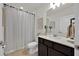 Cozy bathroom with shower and tub combination, modern vanity, and neutral color palette at 1562 Delightful Dr, Davenport, FL 33896