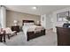 Bedroom with carpet flooring and a bed with two side tables at 1562 Delightful Dr, Davenport, FL 33896