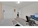 Neutral bedroom with a workspace desk, closet, and carpet flooring at 1562 Delightful Dr, Davenport, FL 33896