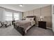 Bedroom with carpet flooring and a bed with two side tables at 1562 Delightful Dr, Davenport, FL 33896