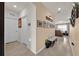 Welcoming foyer featuring neutral tile flooring, complemented by tasteful decorations, and access to living areas at 1562 Delightful Dr, Davenport, FL 33896