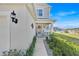 Inviting front porch with stylish bench seating and charming decor, enhancing the home's entrance at 1562 Delightful Dr, Davenport, FL 33896