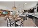 Open concept kitchen features a center island, stainless appliances, and seamless flow to living area at 1562 Delightful Dr, Davenport, FL 33896