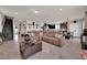 Large living room featuring comfortable seating and an open layout that connects to the kitchen and dining area at 1562 Delightful Dr, Davenport, FL 33896