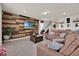 Spacious living room featuring a wood-paneled accent wall, providing a cozy and modern atmosphere at 1562 Delightful Dr, Davenport, FL 33896