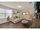 Comfortable living room filled with natural light, stylish décor, and modern furnishings at 1562 Delightful Dr, Davenport, FL 33896
