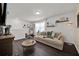 Bright living room with cozy sectional sofa, decorative accents, and plenty of natural light at 1562 Delightful Dr, Davenport, FL 33896