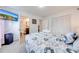 Cozy bedroom with patterned bedding, television, and a convenient ensuite bathroom at 8708 Papaya Dr, Kissimmee, FL 34747