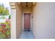 Inviting entryway with a classic front door, fresh paint, and a charming welcome mat at 8708 Papaya Dr, Kissimmee, FL 34747
