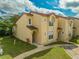 Charming two-story condo with a well-maintained lawn and a classic tiled roof at 8708 Papaya Dr, Kissimmee, FL 34747