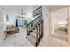 Bright living room with a staircase, tile flooring, and access to a dining area at 8708 Papaya Dr, Kissimmee, FL 34747