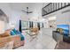 Inviting living space with open-concept design, connecting the living room, dining area, and kitchen at 8708 Papaya Dr, Kissimmee, FL 34747