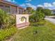 Mango Key community sign surrounded by lush landscaping, offering a vibrant welcome to residents and visitors at 8708 Papaya Dr, Kissimmee, FL 34747