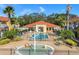 Overhead view of a pool and splashpad with chairs, part of a colorful resort-style community at 1007 Park Ridge Cir, Kissimmee, FL 34746