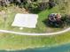 Aerial shot of the community's playground and volleyball court, by a tranquil lake at 1007 Park Ridge Cir, Kissimmee, FL 34746