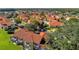 Aerial view of Lake Berkley Resort showing the community pool and splashpad area with colorful townhome units at 1007 Park Ridge Cir, Kissimmee, FL 34746