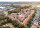 Aerial view of townhouse community with a community pool at 1007 Park Ridge Cir, Kissimmee, FL 34746