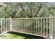 Tranquil backyard view with lush greenery and white fencing, providing a serene and private outdoor space at 1007 Park Ridge Cir, Kissimmee, FL 34746