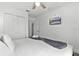 Bright bedroom with a cozy bed, closet, and mounted TV at 1007 Park Ridge Cir, Kissimmee, FL 34746