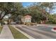 Gated community entrance offering security and privacy amidst lush landscaping at 1007 Park Ridge Cir, Kissimmee, FL 34746