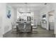 Contemporary dining room featuring a glass table, sleek chairs, and stylish decor at 1007 Park Ridge Cir, Kissimmee, FL 34746