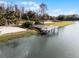 Community waterfront area with a fishing dock, sandy beach, and playground, perfect for Gathering fun at 1007 Park Ridge Cir, Kissimmee, FL 34746