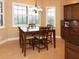 Cozy dining area with natural light, wooden table, and comfortable seating for Gathering meals at 10467 Henbury St, Orlando, FL 32832