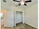 Bright bedroom featuring a ceiling fan, open closet, and view of the doorway at 1258 Royal St George Blvd, Davenport, FL 33896