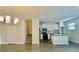 Combined living and kitchen area featuring modern appliances and wood floors at 1258 Royal St George Blvd, Davenport, FL 33896